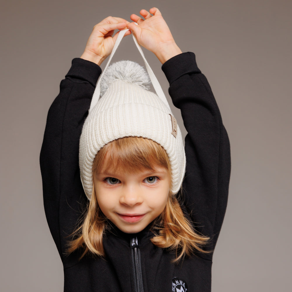 
                      
                        Winter beanie Vanilla — 100% extra fine merino wool, wool-fleece lined, reflective pom-pom
                      
                    