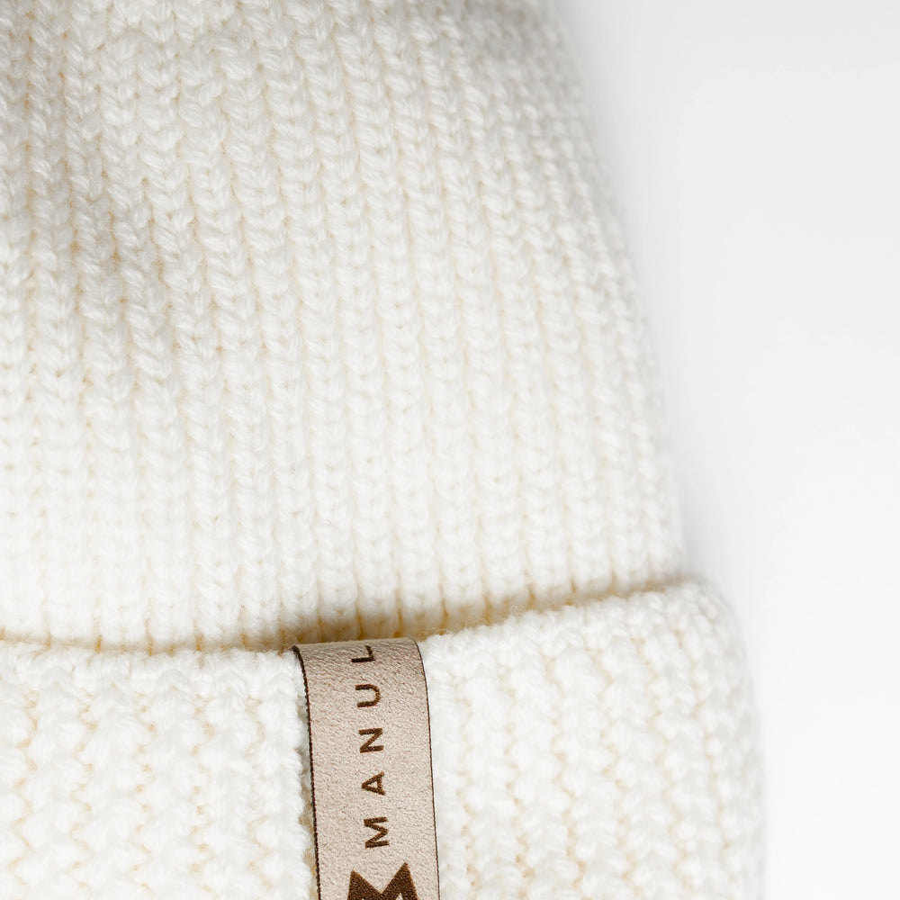 
                      
                        Winter beanie Vanilla — 100% extra fine merino wool, wool-fleece lined, reflective pom-pom
                      
                    